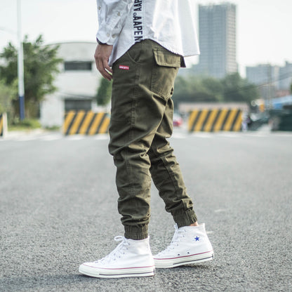 FashionRay street style: olive jogger pants and white high-top sneakers outdoors