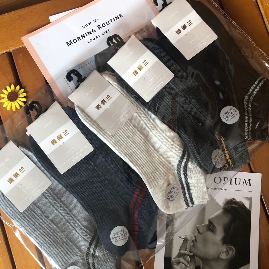 Assorted fashion socks in packaging on a wooden surface, FashionRay trendy accessories