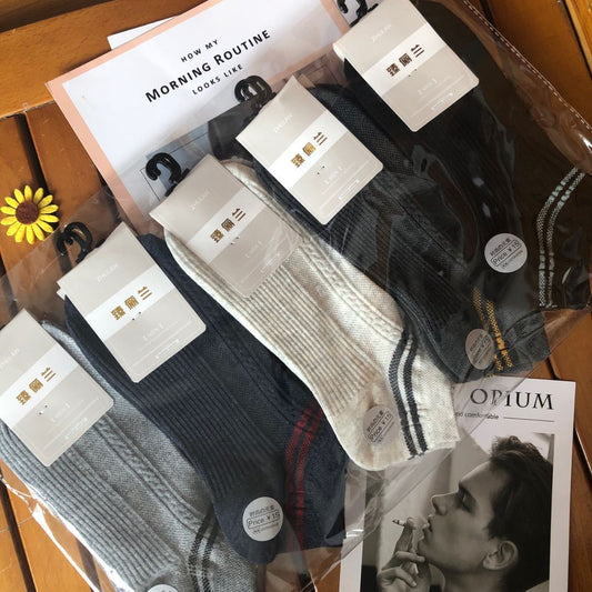 Assorted fashion socks in packaging on a wooden surface, FashionRay trendy accessories