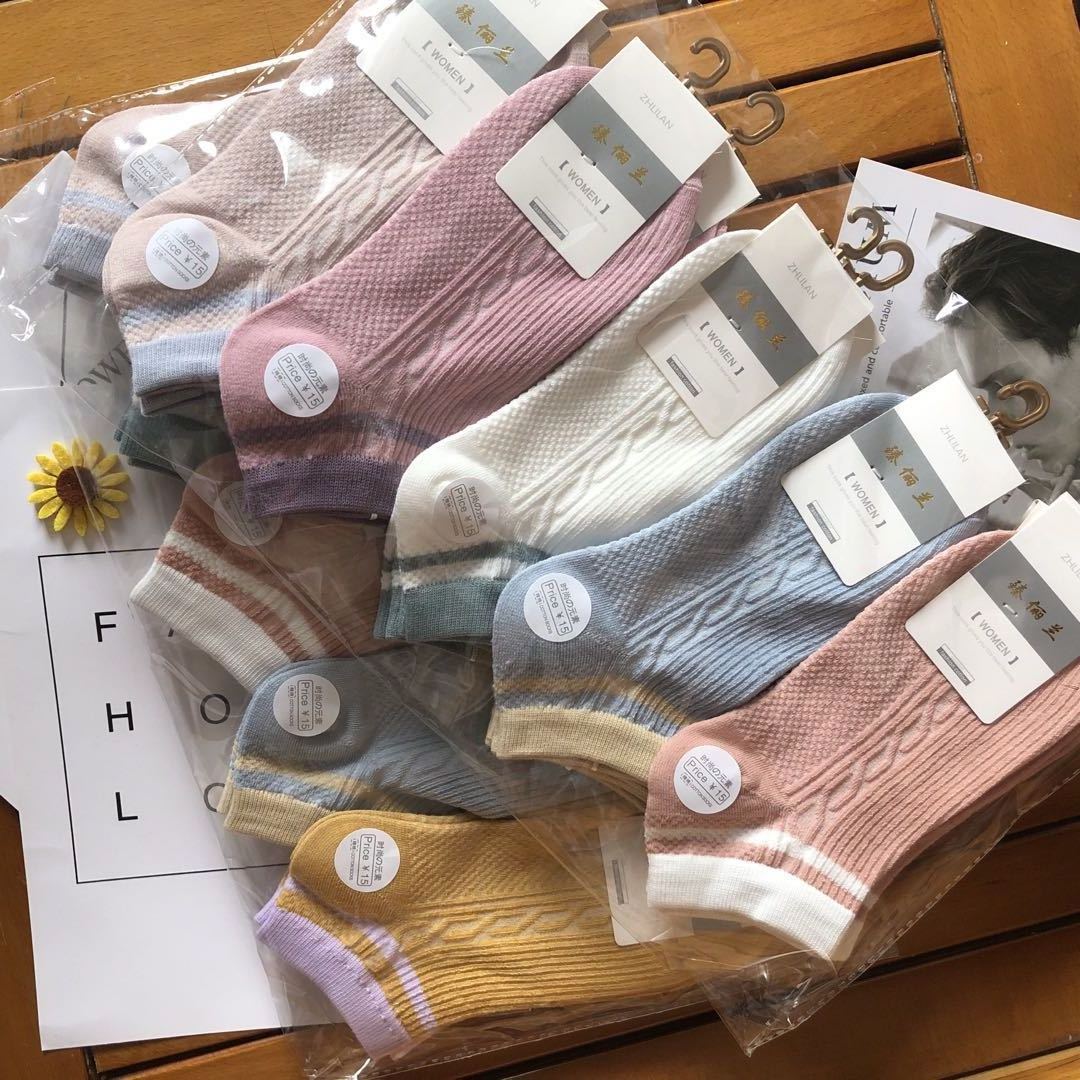 Assorted pastel knit ankle socks in packaging on a wooden table, FashionRay cozy accessories