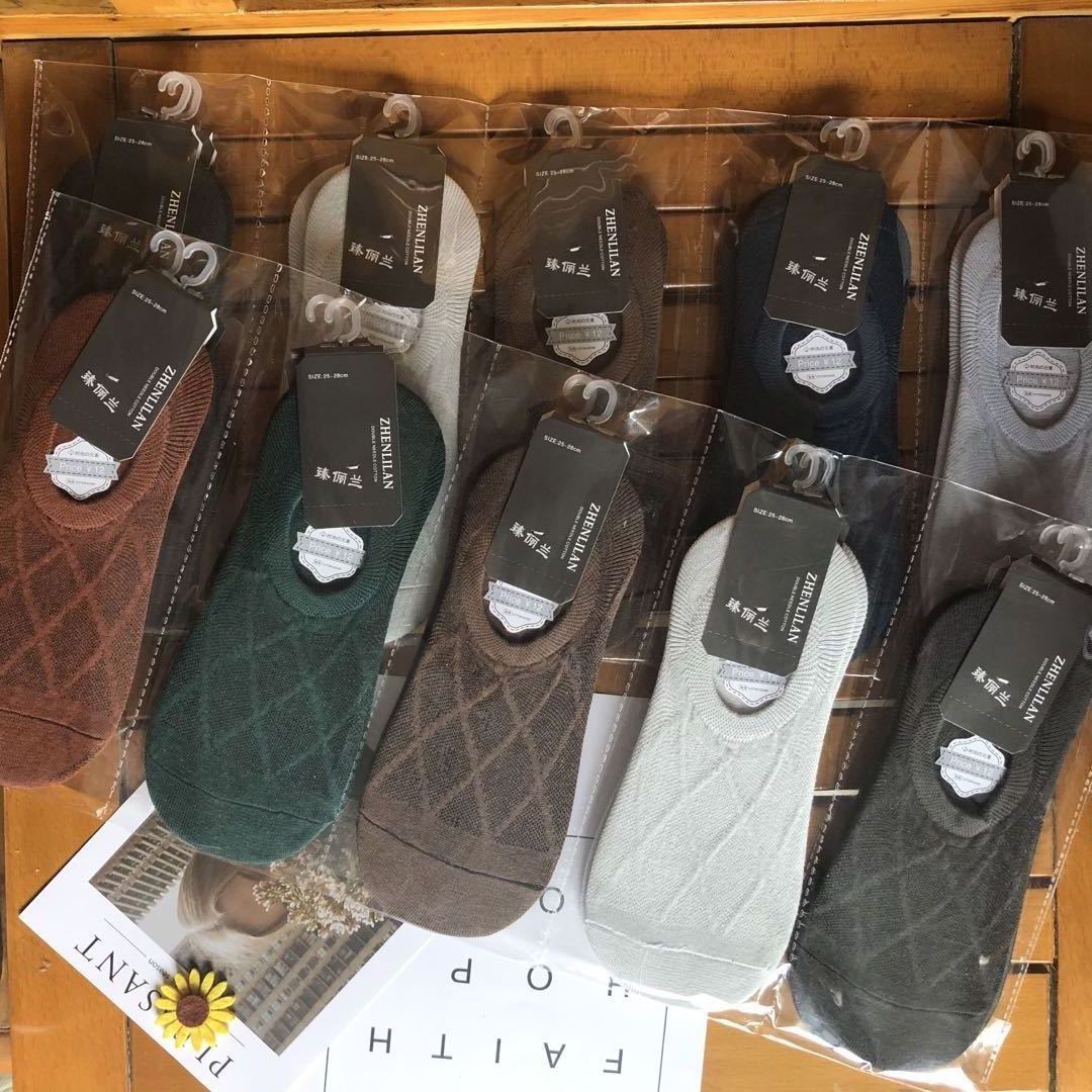 Assorted patterned no-show socks in neutral colors, packaged for sale at FashionRay