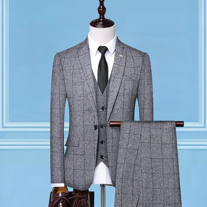 Gray plaid three-piece suit with black tie on mannequin, FashionRay formal menswear