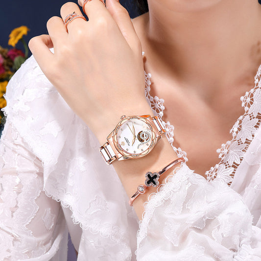 Woman wearing rose gold watch and bracelet with lace white blouse, FashionRay style