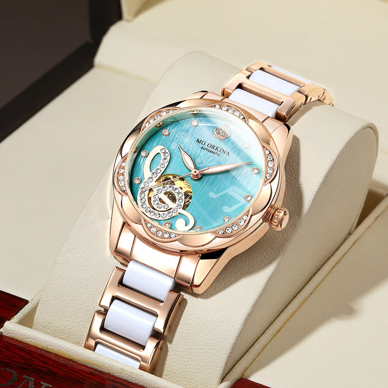 Rose gold women's watch with aqua blue face, crystal accents, music note design, FashionRay