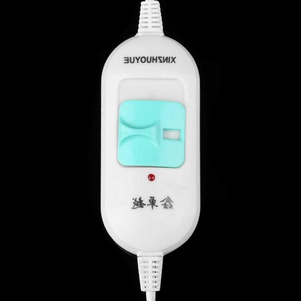 White electric device controller with turquoise switch, black background, FashionRay