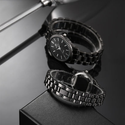 Sleek black metal watch with textured dial on reflective surface, FashionRay style accessory