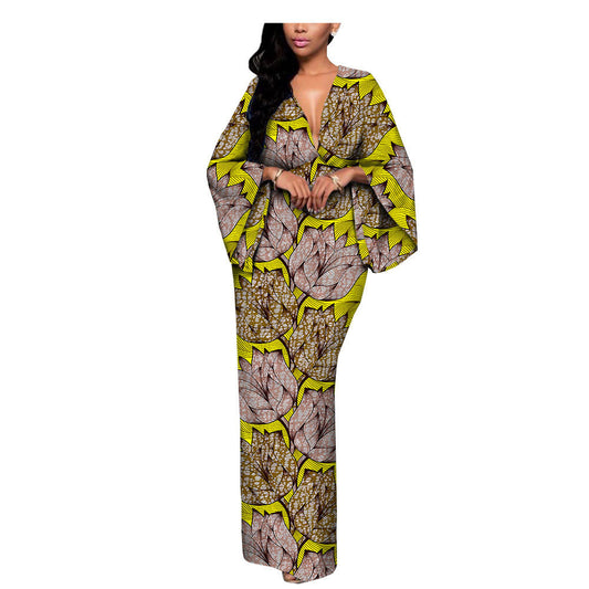 Woman modeling a bold yellow and brown leaf print maxi dress, FashionRay trendy comfort style