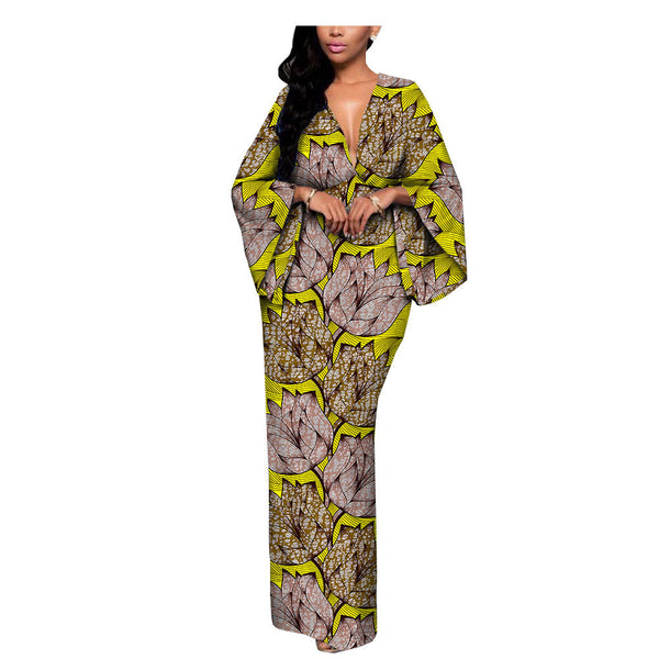 Woman modeling a bold yellow and brown leaf print maxi dress, FashionRay trendy comfort style
