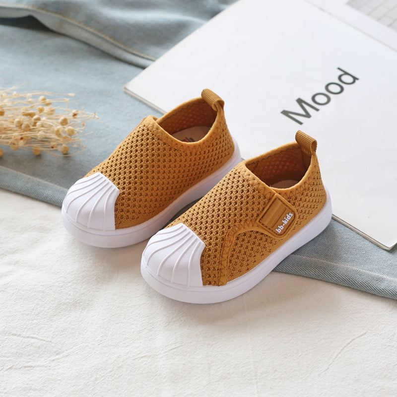 Yellow mesh kids slip-on sneakers with white soles on a light background at FashionRay