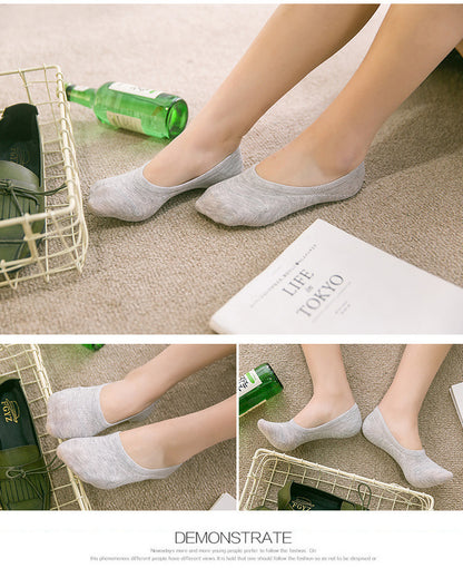 Woman wearing gray no-show socks on beige carpet with fashion accessories, FashionRay style