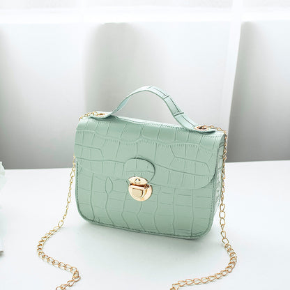 Mint green crocodile-pattern crossbody bag with gold chain and clasp, FashionRay style