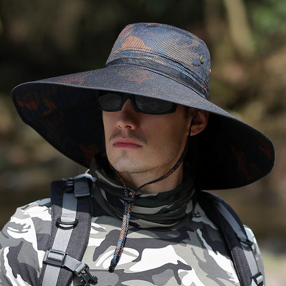 Man in camo shirt and wide-brim sun hat with sunglasses outdoors, FashionRay style