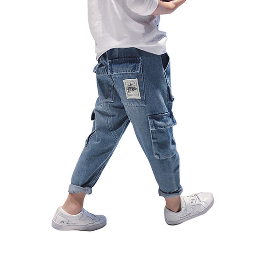 Trendy cargo denim jogger pants with patch detail, styled with white sneakers from FashionRay