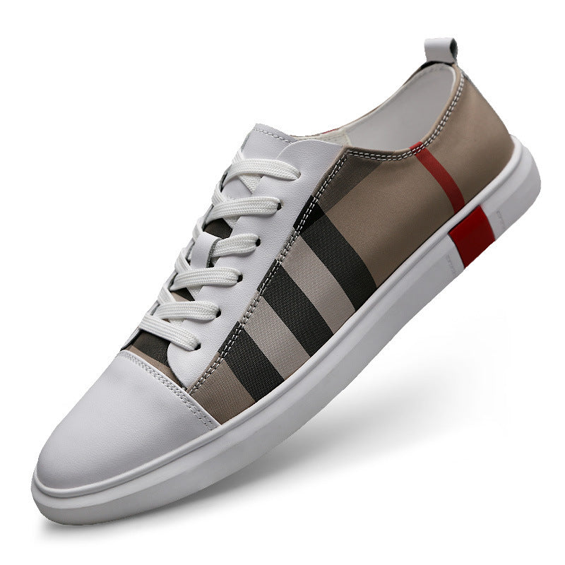 Trendy men's sneaker with white toe, striped side design, and red accent from FashionRay