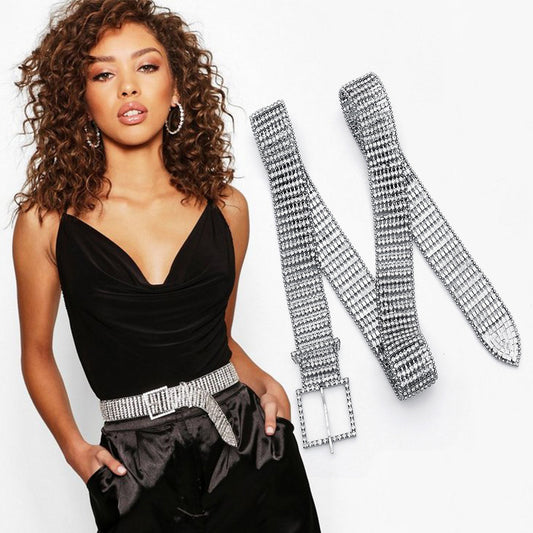 FashionRay model in black top and pants with sparkling rhinestone belt and matching hoop earrings