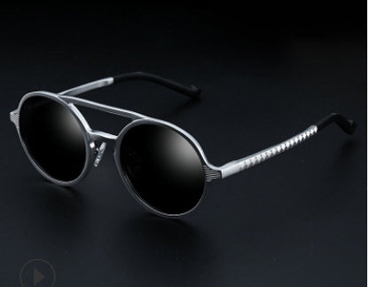 Trendy round black sunglasses with silver metallic frame on dark background, FashionRay style