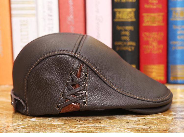 Brown leather newsboy cap with lace-up detail, stylish accessory from FashionRay