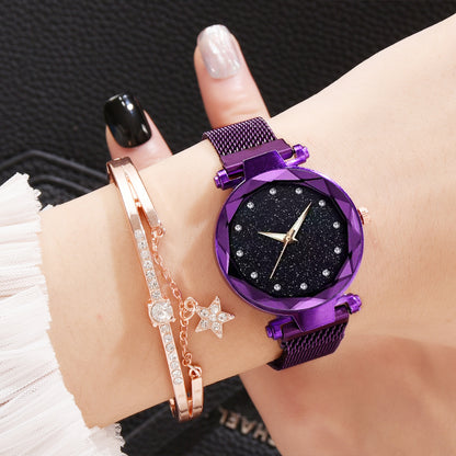 Woman's wrist with a purple starry watch and rose gold crystal bracelet from FashionRay