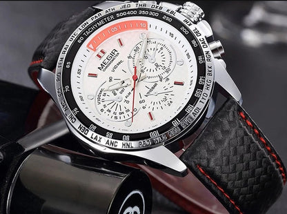 MEGIR chronograph watch with white dial, black bezel, and black leather strap, featured at FashionRay