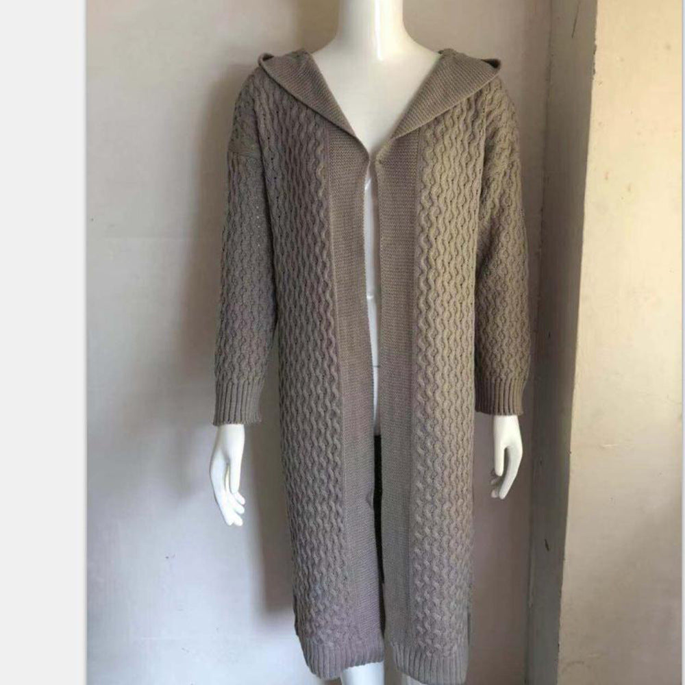 Long beige cable knit hooded cardigan on mannequin, trendy cozy outerwear at FashionRay