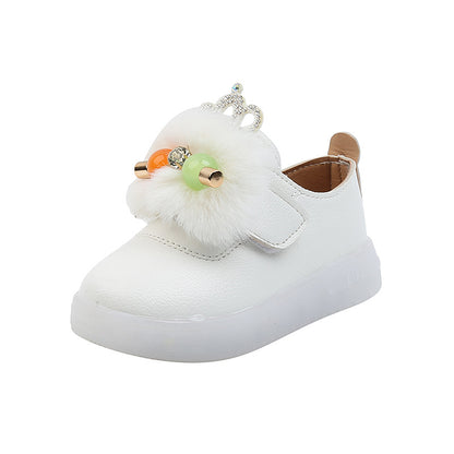 White kids' sneaker with faux fur, colorful beads, and crown detail from FashionRay