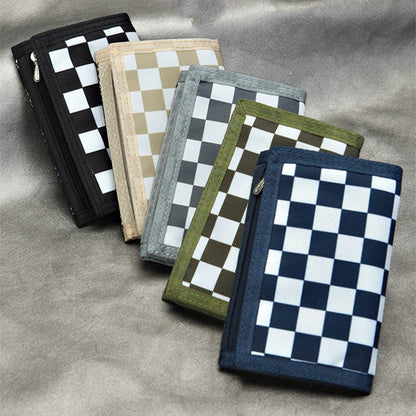 FashionRay checkered wallets in black, beige, grey, green, and blue on a grey surface