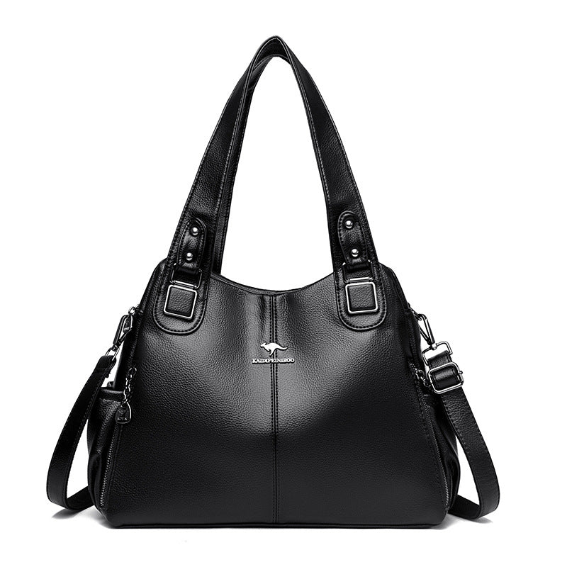 FashionRay black leather handbag with top handles and shoulder strap on white background