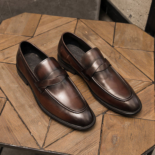 Men's brown leather loafers on a wooden table, FashionRay elegant footwear style