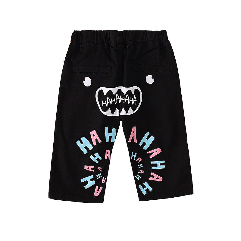 FashionRay kids’ black shorts with playful face and colorful HAHAHA print, trendy style
