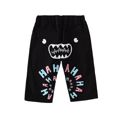 FashionRay kids’ black shorts with playful face and colorful HAHAHA print, trendy style