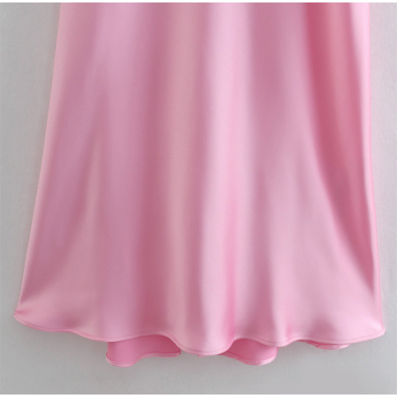 Close-up of pink satin slip dress hem, soft fabric, FashionRay trendy comfortable style