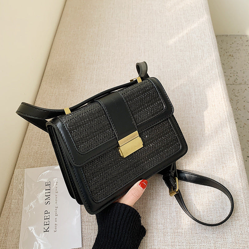 FashionRay stylish black woven crossbody bag with gold clasp on beige sofa