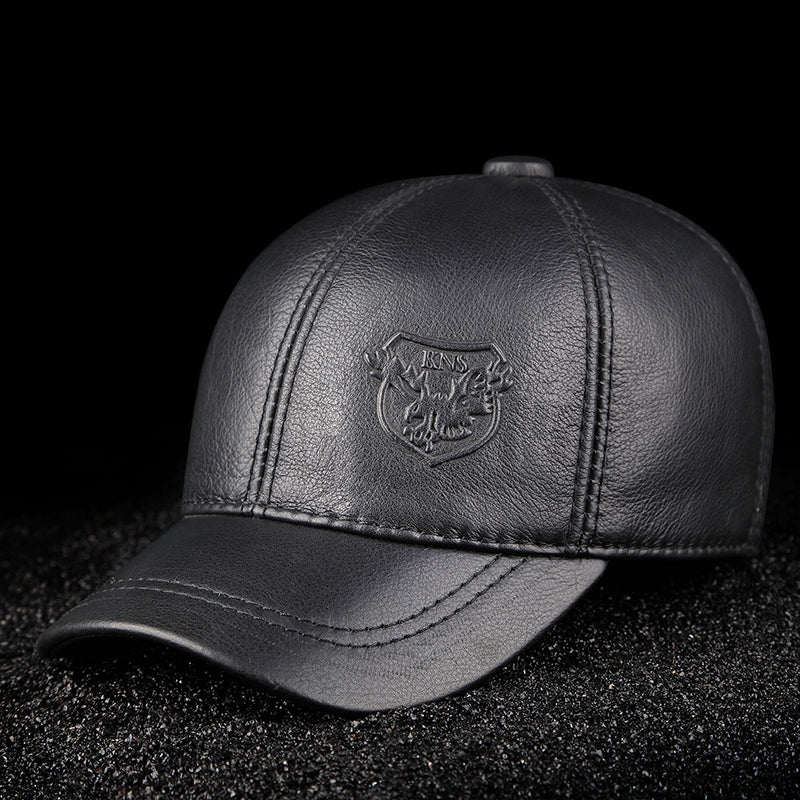 FashionRay black leather baseball cap with embossed eagle crest on black textured background