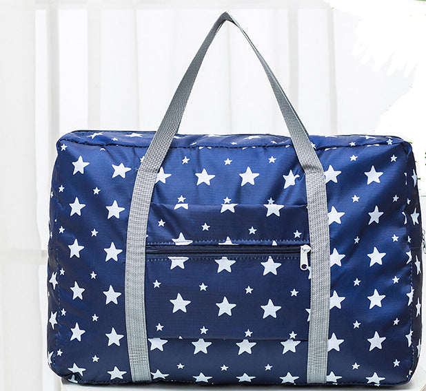 Navy blue star print travel bag with grey handles from FashionRay