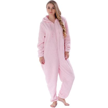 Woman wearing a pink fleece hooded onesie, cozy loungewear from FashionRay