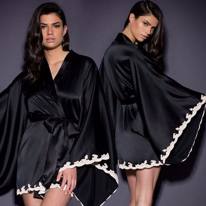 Two women wear black satin kimono robes with white lace trim, FashionRay sleepwear style