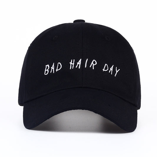 Black baseball cap with 'BAD HAIR DAY' text, trendy casual accessory from FashionRay