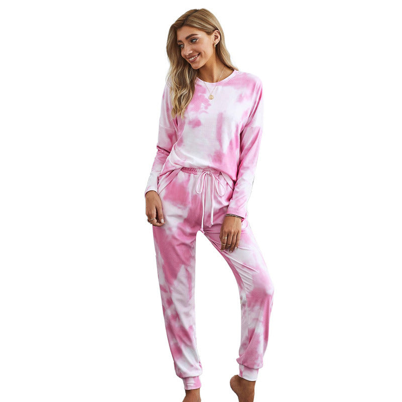 Woman in pink and white tie-dye lounge set, trendy comfortable fashion from FashionRay
