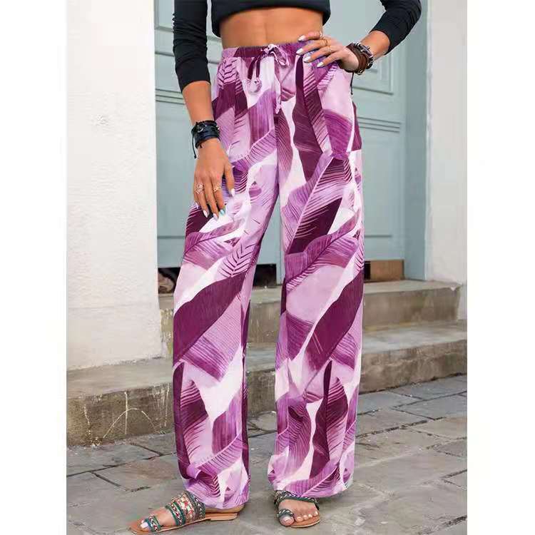 Woman wearing purple leaf print wide leg pants and sandals, FashionRay trendy street style