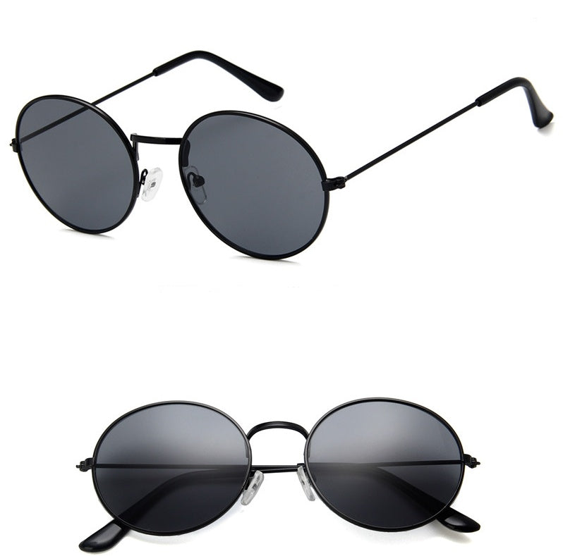 Round black sunglasses with dark lenses, trendy eyewear from FashionRay on white background.
