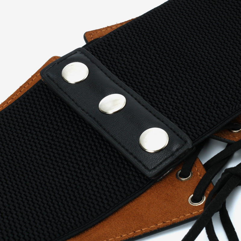 Black elastic fashion belt with silver snap buttons and brown faux suede accents