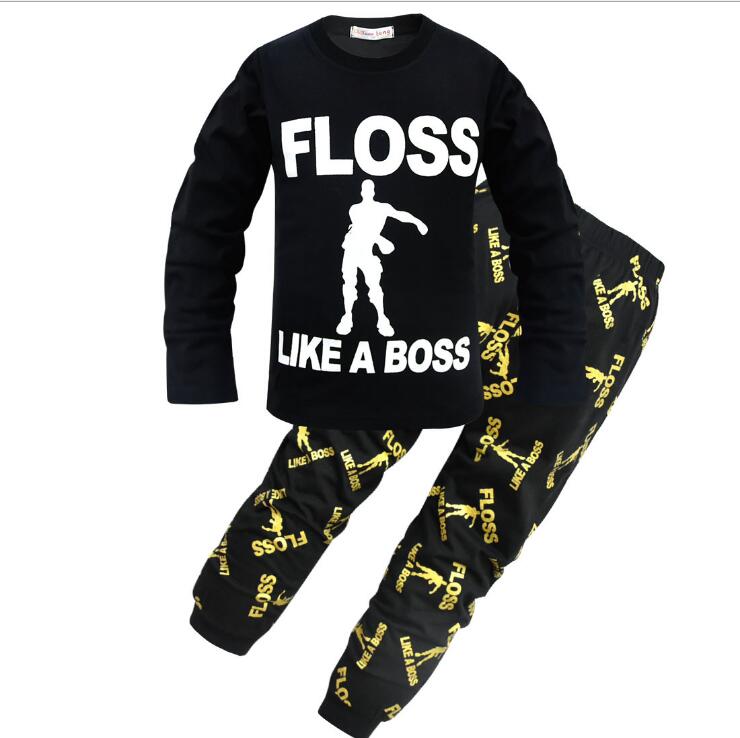 Kids black pajama set with 'Floss Like A Boss' text and dancer graphic, FashionRay trendy loungewear.