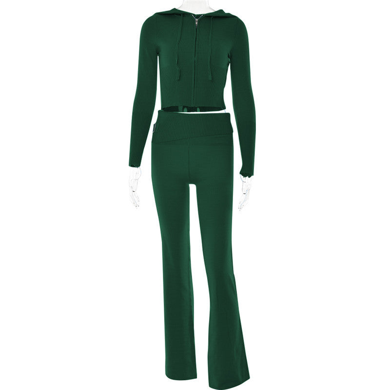 Green ribbed two-piece set with zip-up cropped hoodie and flared pants on mannequin, FashionRay