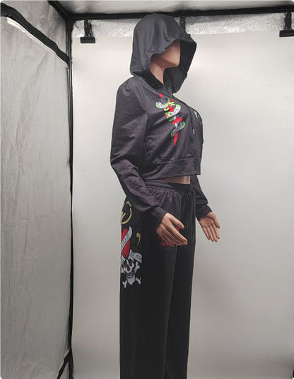Mannequin in black hooded tracksuit with bold graphic prints, FashionRay trendy loungewear