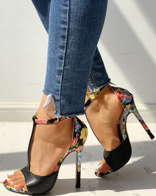 Woman wearing floral high heel sandals with blue jeans, FashionRay chic trendy footwear
