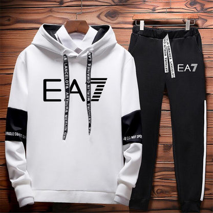 Trendy white and black EA7 hoodie and jogger set on wood backdrop, FashionRay loungewear