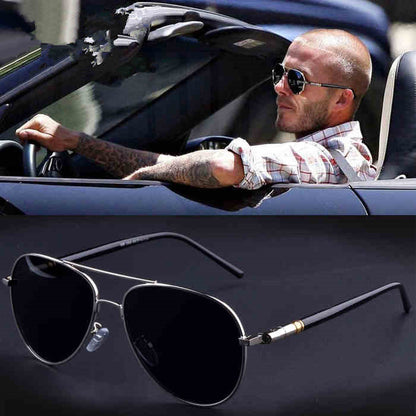 Man in convertible wearing black aviator sunglasses, close-up of sunglasses below, FashionRay style.