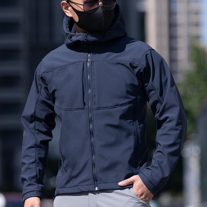 Man in navy hooded jacket and sunglasses outdoors, modern casual fashion by FashionRay