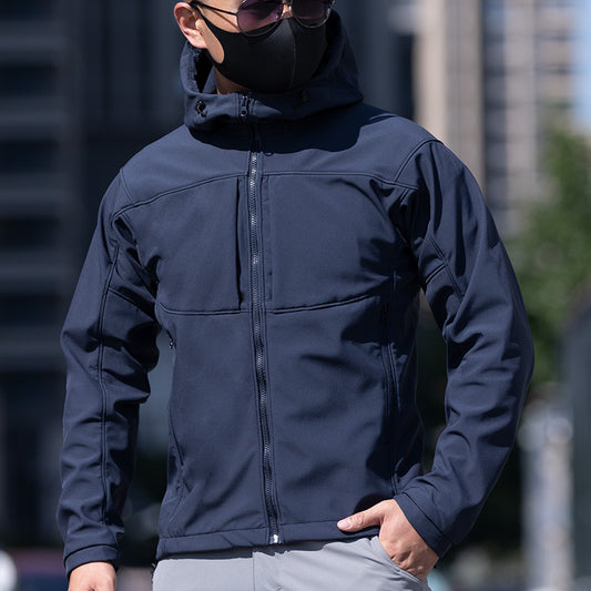 Man in navy hooded jacket and sunglasses outdoors, modern casual fashion by FashionRay