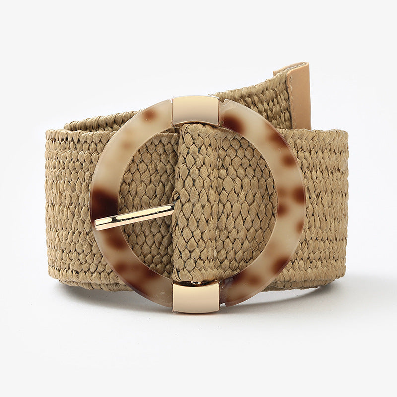 Beige woven belt with tortoiseshell round buckle, trendy accessory at FashionRay